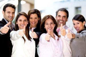 Business people with thumbs up