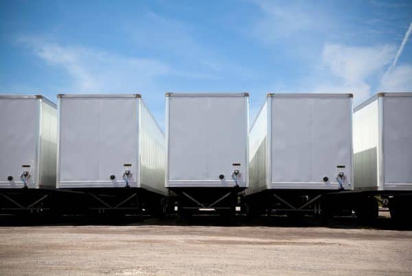 A Set Of Trailers Waiting to Be Moved with a Electric Trailer Dolly