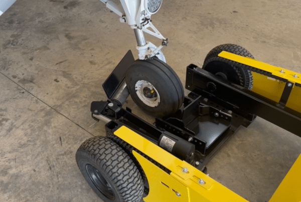 roller arm attachment to load aircraft on to yellow aircraft tug